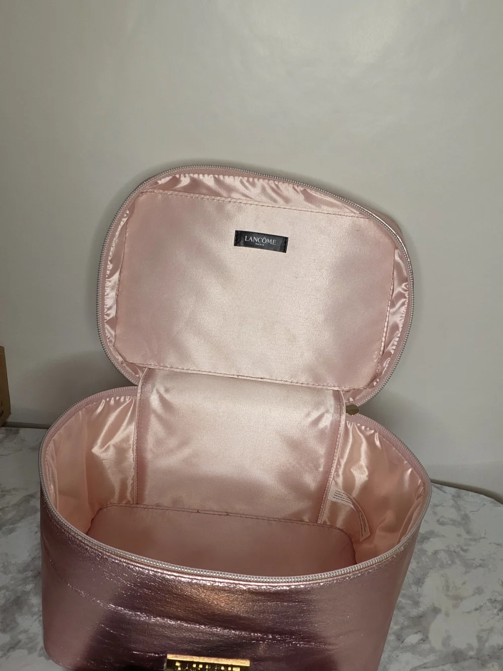 Lancome cute travel case for metallic pink makeup along with a palette of neutra